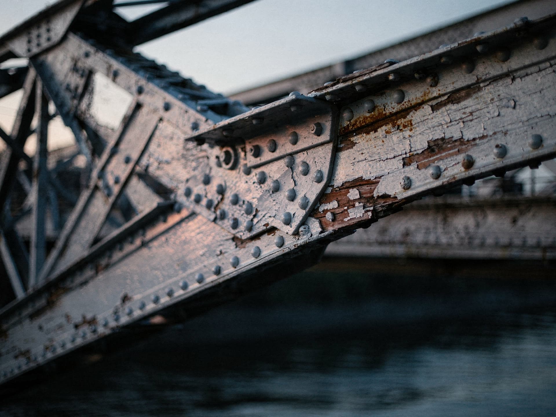 Bridge span ironwork over the Merrimack River at dusk.